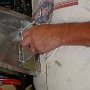 Installing mounting bracket for fuel distribution module