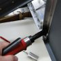 Installing nutplate to back of avionics panel.
