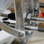 Throttle/Governor cables threaded through bracket.