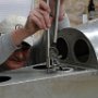Riveting of magnetometer bracket to rear of fuslage.
