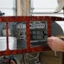 Installing connectors to rear of avionics tray.