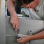 Installing ELT tray in rear compartment
