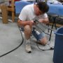 Cleaning hole just cut in engine baffling