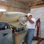 Installing upper engine cowl over engine
