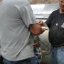 Adding tank sealant to seal edges of firewall recess panel. Help from Jim Skala
