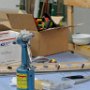 Riveting canopy side skirts to canopy side frame