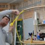 Masking off canopy frame to prepare for sika flex primer adhesion