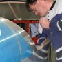 Installing canopy roller rails to fuselage