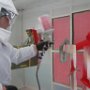 Spraying Pearl Red on Landing Gear Fairings